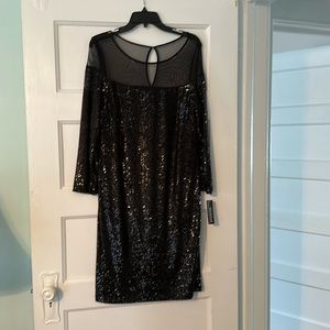 R & M Richards black sequined dress with sheer fabric around neckline.